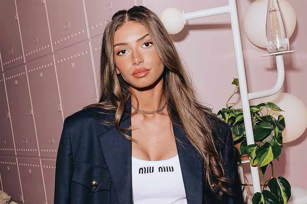 Mimi Keene wearing a Miu Miu outfit and dark blazer